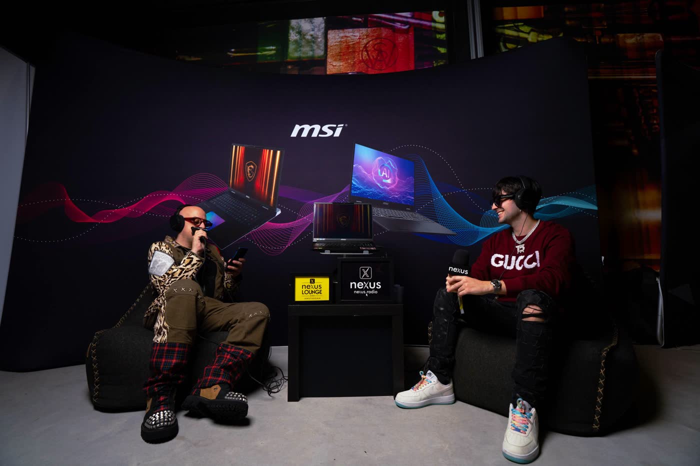 Two artists seated on the Nexus Radio interview set in the Nexus Lounge